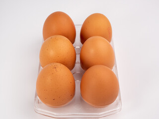 Chicken eggs on a white background. Brown egg on a white background.