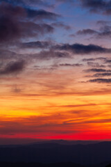 Multicolored sky gradient with clouds