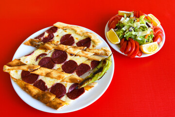 Kiymali pide. Turkish pide with minced meat. Turkish pizza mince pita Pide on white background. Etli ekmek. Kusbasili pide.