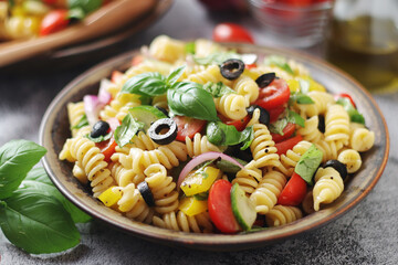A bowl with traditional Italian pasta salad	
