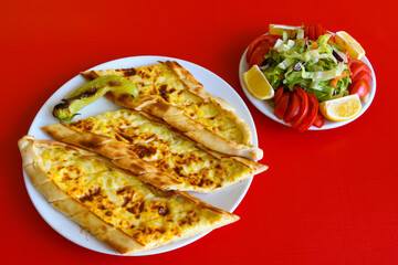 Kiymali pide. Turkish pide with minced meat. Turkish pizza mince pita Pide on white background. Etli ekmek. Kusbasili pide.