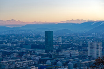 Aerial view over City of Zürich with Swiss Alps in the background on a sunny autumn evening. Photo taken December 6th, 2022, Zurich, Switzerland.