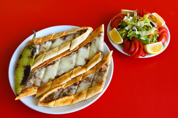 Kiymali pide. Turkish pide with minced meat. Turkish pizza mince pita Pide on white background. Etli ekmek. Kusbasili pide.