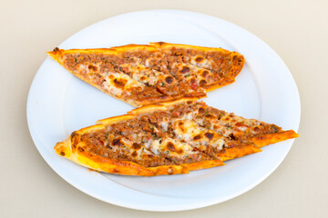 Kiymali pide. Turkish pide with minced meat. Turkish pizza mince pita Pide on white background. Etli ekmek. Kusbasili pide.