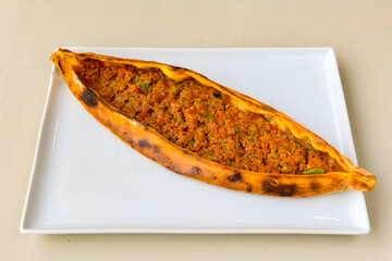 Kiymali pide. Turkish pide with minced meat. Turkish pizza mince pita Pide on white background....