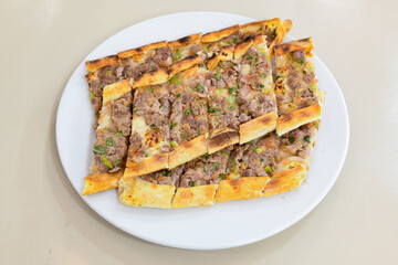 Kiymali pide. Turkish pide with minced meat. Turkish pizza mince pita Pide on white background. Etli ekmek. Kusbasili pide.