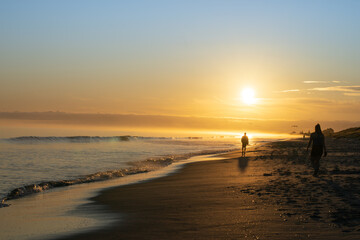 Fototapeta na wymiar Papamoa beach into morning sun