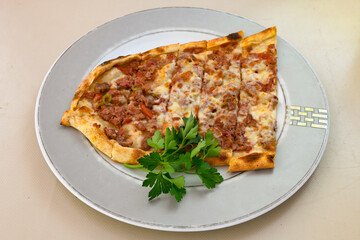 Kiymali pide. Turkish pide with minced meat. Turkish pizza mince pita Pide on white background. Etli ekmek. Kusbasili pide.