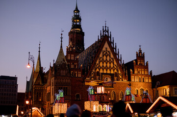 Old church. Evening in Poland. Wroclaw. Christmas fair in the Poland. old town. Christmas lights.
