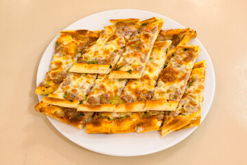 Kiymali pide. Turkish pide with minced meat. Turkish pizza mince pita Pide on white background. Etli ekmek. Kusbasili pide.