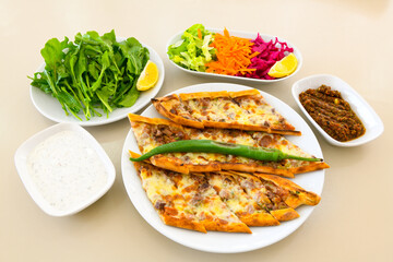 Kiymali pide. Turkish pide with minced meat. Turkish pizza mince pita Pide on white background. Etli ekmek. Kusbasili pide.