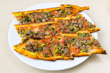 Kiymali pide. Turkish pide with minced meat. Turkish pizza mince pita Pide on white background. Etli ekmek. Kusbasili pide.