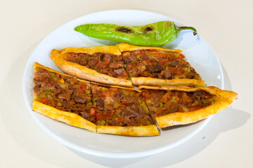 Kiymali pide. Turkish pide with minced meat. Turkish pizza mince pita Pide on white background. Etli ekmek. Kusbasili pide.