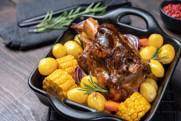 Pork shank knuckle with baked potatoes and corn	 - obrazy, fototapety, plakaty