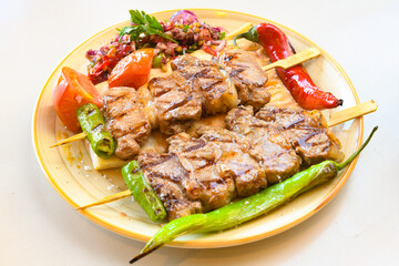 Beef steak grill with rice pilaf, fried potatoes, grilled pepper and tomatoes.Mix Platter with Beef rips, Cutlets, Potatoes and Sauces.
