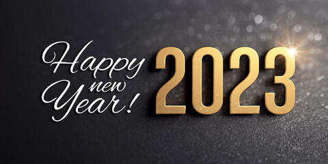 Fototapeta na wymiar Happy New Year greetings and 2023 date number colored in gold, on a glittering black card
