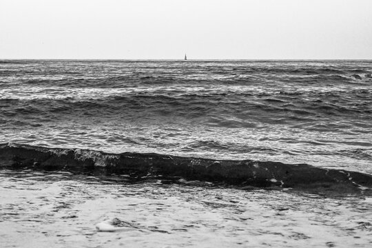 Dramatic Ocean Waves Crashing on Rocky Beach, Black and White