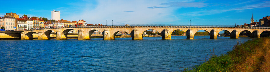 Fototapeta na wymiar Panoramic view of old bridge over Saona and loire river in Macon, France