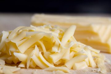 Sliced and grated hard cheese with cashew nuts
