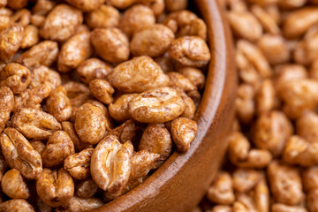 Grain wheat covered with a thin layer of chocolate
