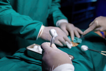 A team of professional doctors perform surgery in a hospital, a group of surgeons working in the operating theater.