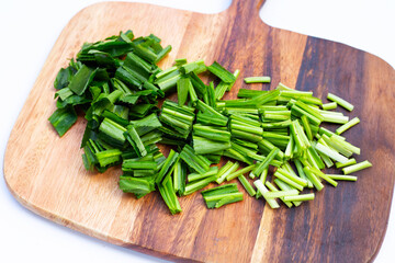 Culantro or sawtooth coriander on cutting board on white background.