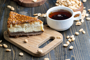 Cheesecake made of dairy products and peanuts in caramel