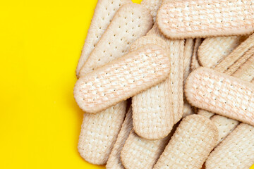 Biscuits on yellow background. Copy space
