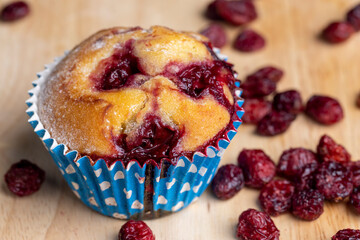 wheat cupcake with red cherries