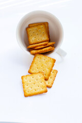 Dry cracker cookies on white background.