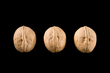Walnut  Nuts isolated on black background.
