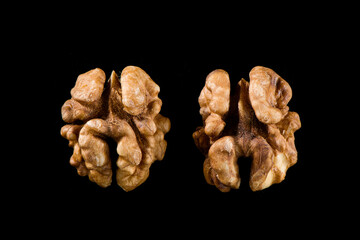 Walnut kernel, Nuts isolated on black background.