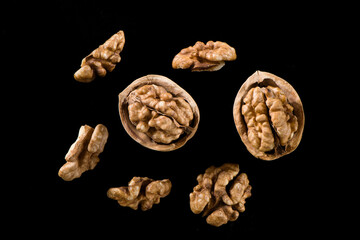Walnut kernel, Nuts isolated on black background.