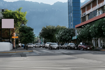 Picturesque view of city street with cars on road near beautiful buildings