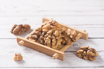 Walnut kernels nut on wooden table.