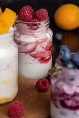 yogurt with fresh berries and raspberry jam