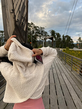 GIRL PUTTING ON HER COLD CAP