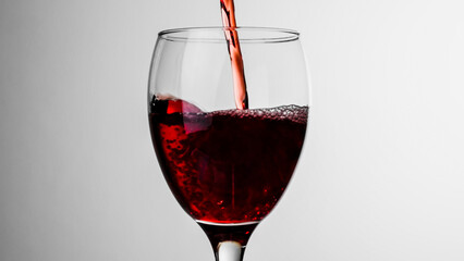 Naklejka na ściany i meble グラスに注がれる赤ワイン　アルコールイメージ