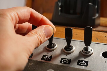 Buttons in control center control boat and light button switch. Boats panel electric control save on consumption.