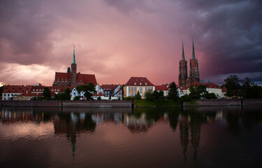 Wroclaw, Poland. Cathedral of St. John the Baptist view over the Odra river dusk view with dramatic sky.