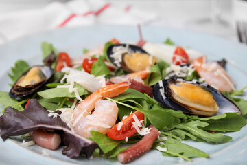 Plate of delicious salad with seafood, closeup view
