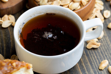 Green tea brewed in a white porcelain mug