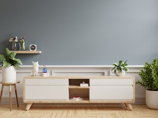 Cabinet for TV and decoration minimal on dark blue color wall background.
