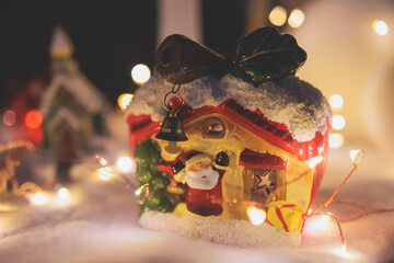 Christmas market details with New Year decorations and multicolored flags, garlands and festoons, Xmas atmosphere, fair interior, retail and store with illumination, New Year glowing decor