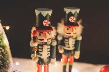 Christmas market details with New Year decorations and multicolored flags, garlands and festoons, Xmas atmosphere, fair interior, retail and store with illumination, New Year glowing decor