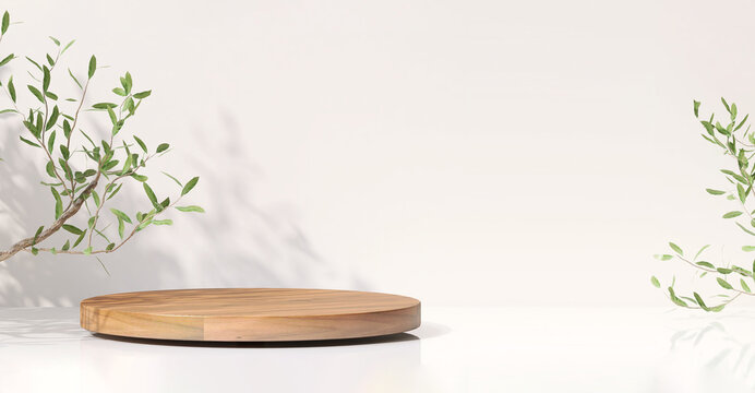 Wooden round tray podium, green tree twig on white glossy table counter in sunlight, leaf shadow with wall for luxury beauty, organic, health, cosmetic, jewelry fashion product display background