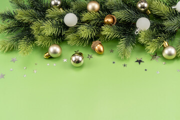 Fototapeta premium Christmas Decorations with stars confetti on green background. Holiday pattern background.