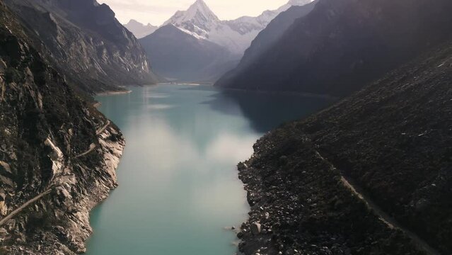 Laguna Paron, Lake in Peru, Unpolluted Clean Natural Lagoon Aerial Drone Above Reservoir in Cordillera de los Andes, Peruvian Pyramid Mountain