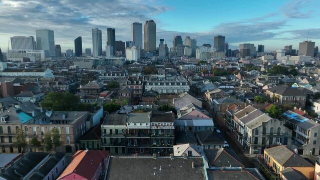 New Orleans skyline aerial establishing shot. French Quarter with St Louis Cathedral. Dramatic clouds. Aerial truck shot.