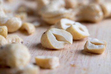 Fototapeta na wymiar Fresh peeled cashew nuts on the table